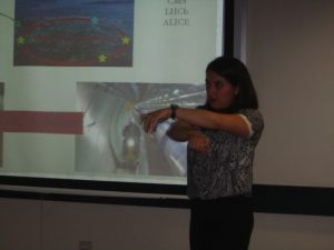 Teacher demonstrating using her arms.